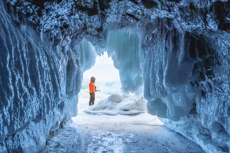 Frozen ice cave at frozen lake Baikal in Siberia, Russiaの写真素材