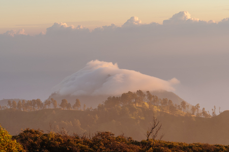 Mountain range landscape and cloud over peak in the morningの写真素材