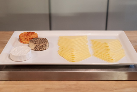 Various types of Cheese on white tray for appetizer and food ingredientsの写真素材