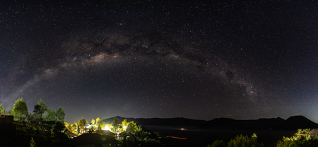 Panoramic milky way and starry sky at night in Semeru National Park, Indonesiaの写真素材
