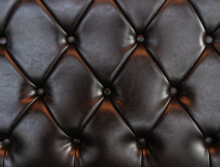 Elegant luxury dark brown leather with buttons. Leather pattern texture backgroundの写真素材