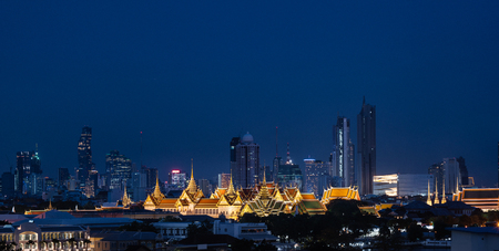 Grand palace and Wat Phra Kaew surround by modern buildings, in Bangkok city Thailandのeditorial素材