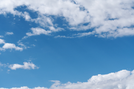 Blue sky with white clouds backgroundの写真素材