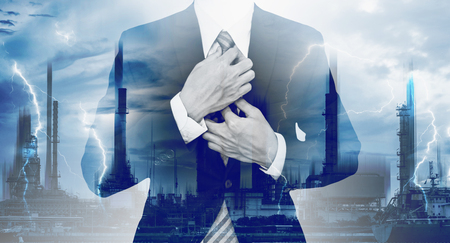 Power and Energy Business. Double exposure, businessman and electrical power plantsの写真素材