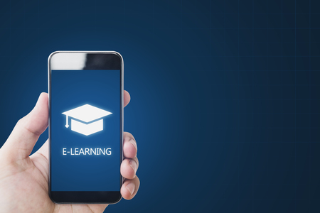 Online education, e-learning and e-book concept. Hand using mobile smart phone for online educationの写真素材