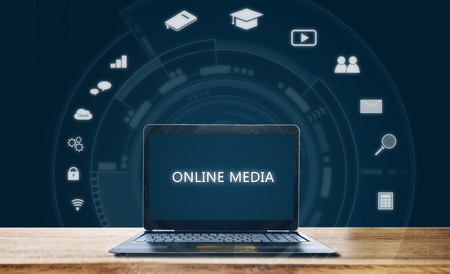 Online media on computer laptop. Online media applicationsの写真素材