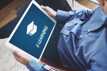 Online education, e-learning and e-book concept. a man using digital tablet for education at homeの写真素材