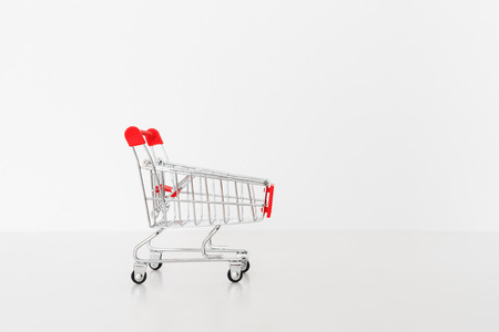 Empty shopping cart, isolated on white backgroundの写真素材