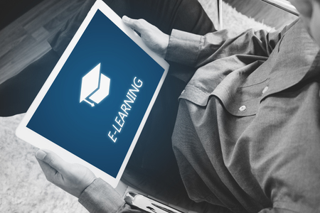 Online education, e-learning and e-book concept. a man using digital tablet for educationの写真素材