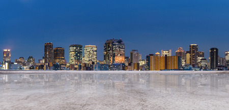Panoramic Osaka city view at night, with empty concrete floor. City backgroundの写真素材
