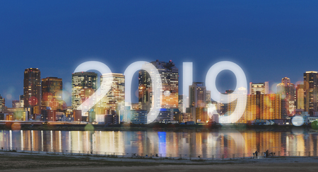 New Year 2019 in the city. Panoramic city at night with happy new year 2019 celebrationの写真素材