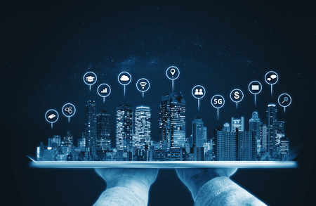 Augmented reality technology, Modern buildings hologram and technology icons. Smart city, internet and networking smart technologyの写真素材