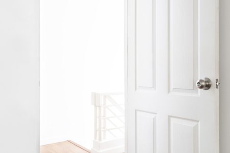 House rental and real estate, opened door with empty white spaceの写真素材