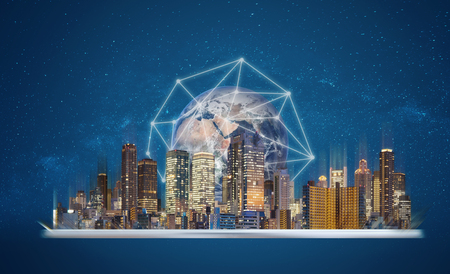 Augmented reality, smart technology and smart city technology. Digital tablet with building hologram and global network connection technology.の写真素材