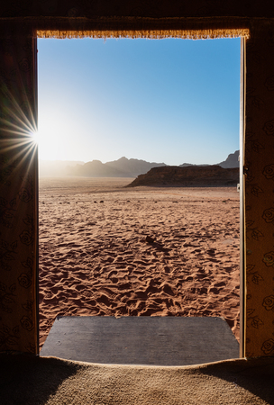 Traveling in Wadi Rum desert, Jordan. Door frame with desert view in sunriseの写真素材