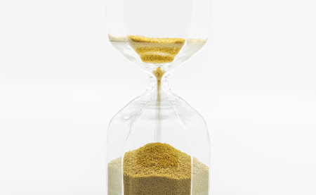 Close up Sand clock, on white backgroundの写真素材