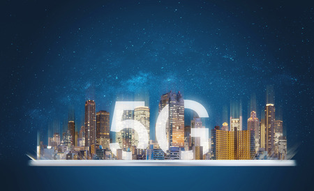 5G internet network in the city, building and 5g in the city on digital tabletの写真素材