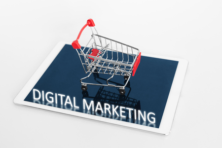 Digital Marketing. Shopping cart on digital tablet, on white backgroundの写真素材
