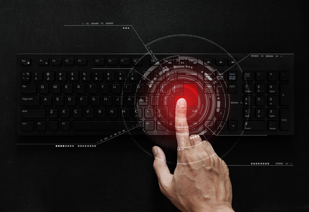 Hand pushing red button on computer keyboard, computer network and connection technology. Computer data security system and ID verification system technologyの写真素材