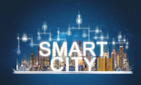 Smart city and building technology. Augmented reality buildings with online media and network application icons on digital tabletの写真素材
