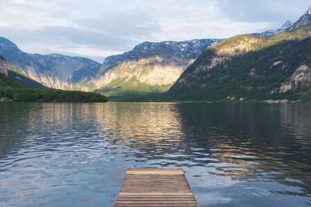 Alpine mountain range with lake in summer in Hallstatt, Austriaの写真素材