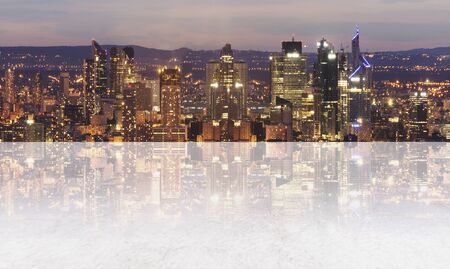 Panoramic city at night with empty concrete floorの写真素材