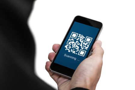 QR code scanning payment and verification. Businessman holding mobile smart phone scan QR code on screenの写真素材