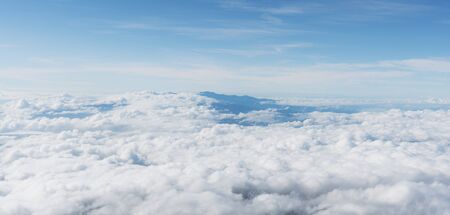 Aerial view over clouds, Blue sky with white cloud in the morningの写真素材