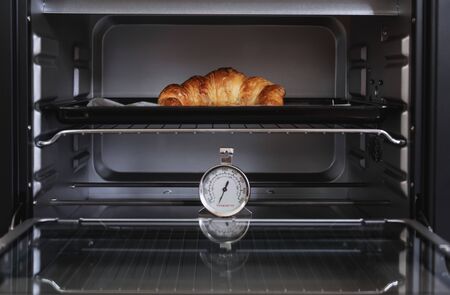 Fresh baked Croissant in ovenの写真素材