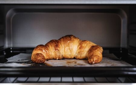 Fresh baked Croissant in ovenの写真素材