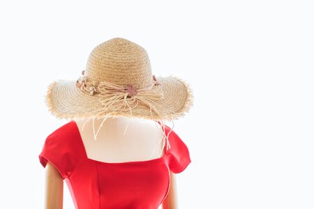 Close-up red dress with summer hat on fashion model, isolated on white backgroundの写真素材
