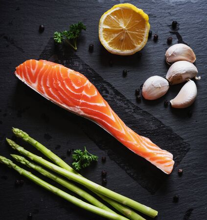 Fresh raw Salmon slice with herb and ingredientsの写真素材
