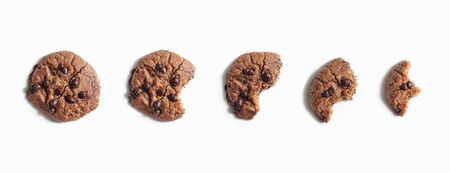 Chocolate chip cookies, five devoured steps isolated on whiteの写真素材