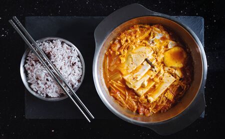 Traditional Korea food, Kimchi Jjigae soup with rice. Top viewの写真素材