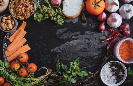 Fresh organic food ingredient, vegetables, herb and spices on black stone texture. Food Backgroundの写真素材
