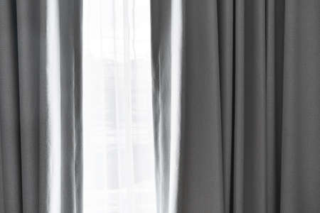 Close-up white curtain with bright sunlightの写真素材
