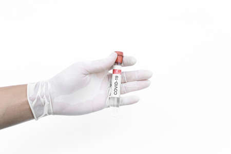 Covid-19 vaccine. Hand holding corona virus immune vaccine, isolated on white backgroundの写真素材
