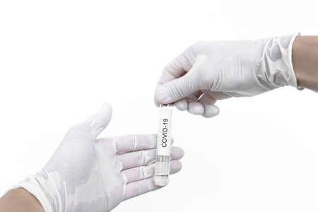 Covid-19 vaccine. Hand holding corona virus immune vaccine, isolated on white backgroundの写真素材