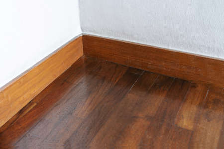 Old wood floor with white wallの写真素材