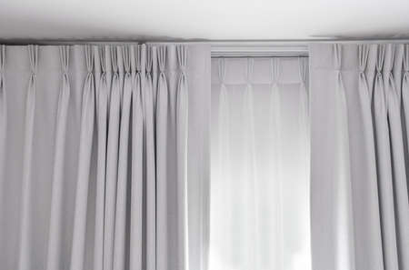 Two layers curtain with rails, installed on ceiling, translucent and blocking lights curtainの写真素材