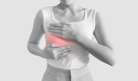 Woman checking breast cancer by herself, Self check breast cancer on womanの写真素材