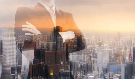 Double exposure businessman, and city sunrise backgroundの写真素材