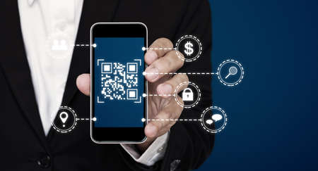 QR code technology. Scanning payment and ID verification by QR code on mobile smart phoneの写真素材