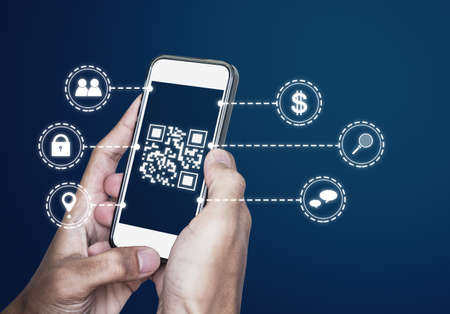QR code technology. Scanning payment and ID verification by QR code on mobile smart phoneの写真素材
