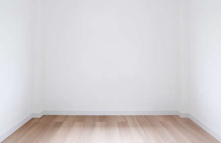 Home interior, empty room. White wall and ceiling with wood floorの写真素材