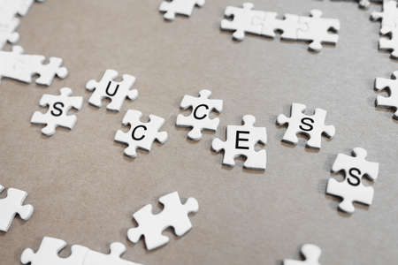 SUCCESS, white jigsaw puzzlesの写真素材