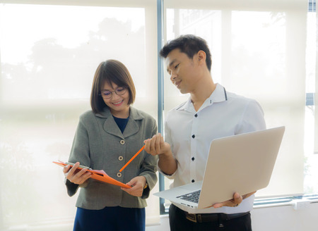 Businessmen and partner felt great with financial data and market growth statistics that increased profits in the company.の写真素材