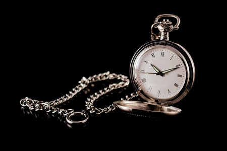 Pocket watch on a black backgroundの写真素材
