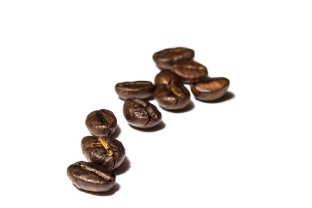 a handful of coffee beans on white backgroundの写真素材
