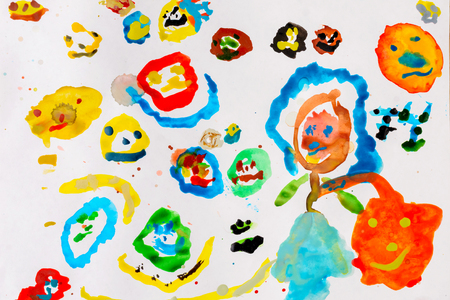 Childrens drawing with colored watercolor paints on a white sheet of paperの写真素材